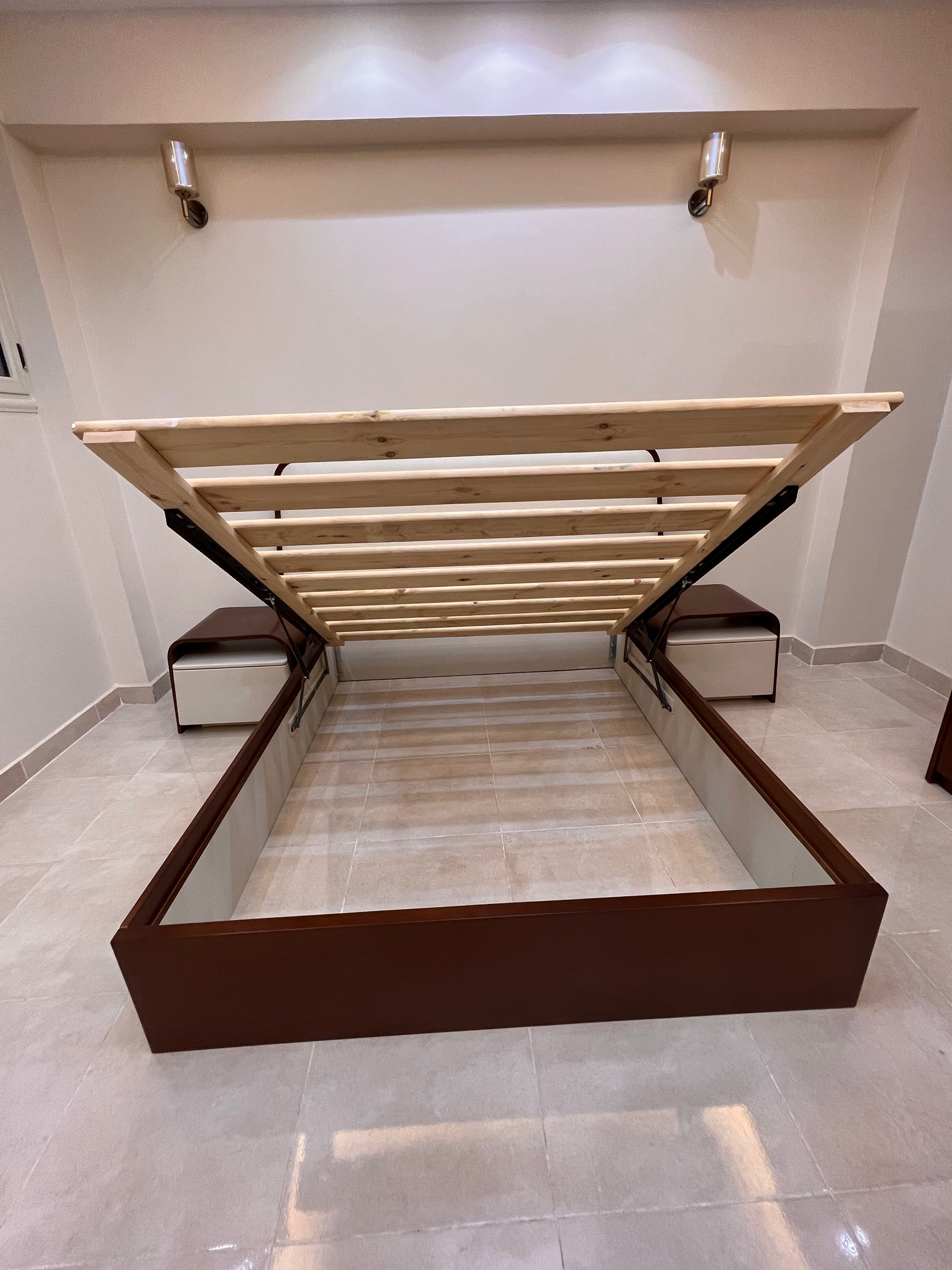 Wooden bed frame with lifting mechanism in a room setting